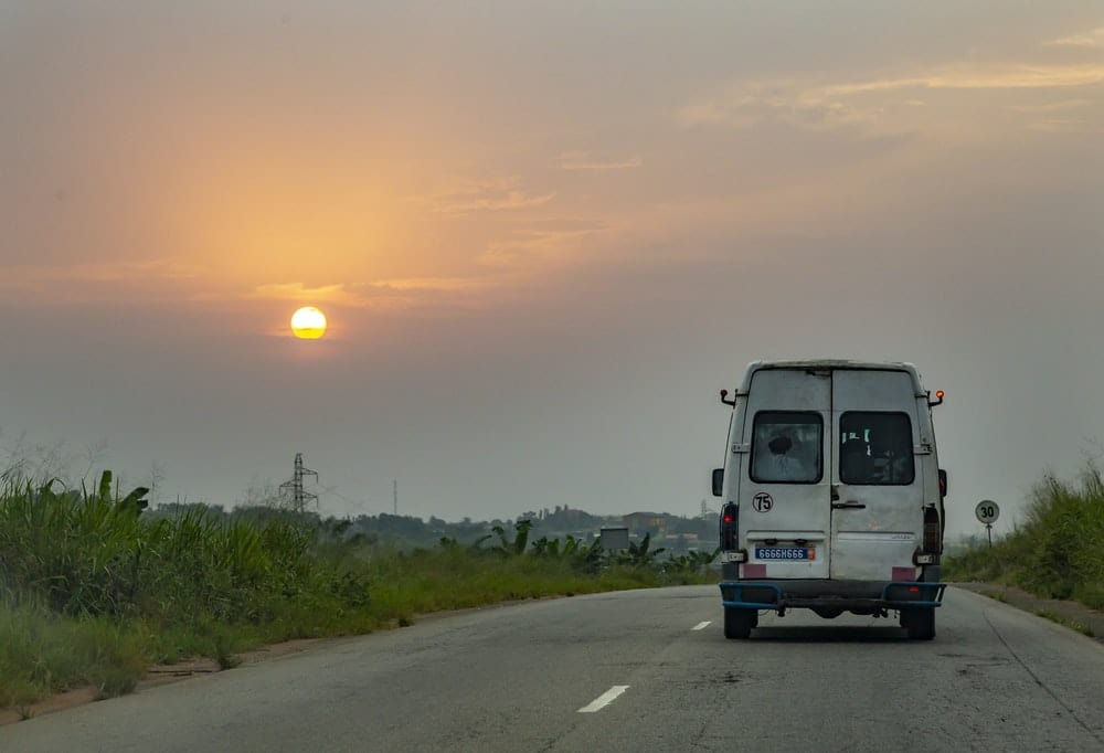 Cross Stitch | Abidjan - White Van At Road During Daytime - Cross Stitched