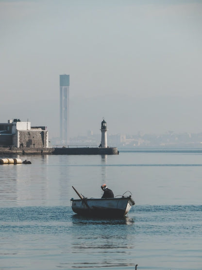 Cross Stitch | Algiers - Man In Black Shirt Riding On Boat During Daytime - Cross Stitched