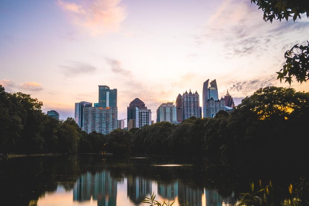 Cross Stitch | Atlanta - Body Of Water Near Trees And Buildings During Daytime - Cross Stitched