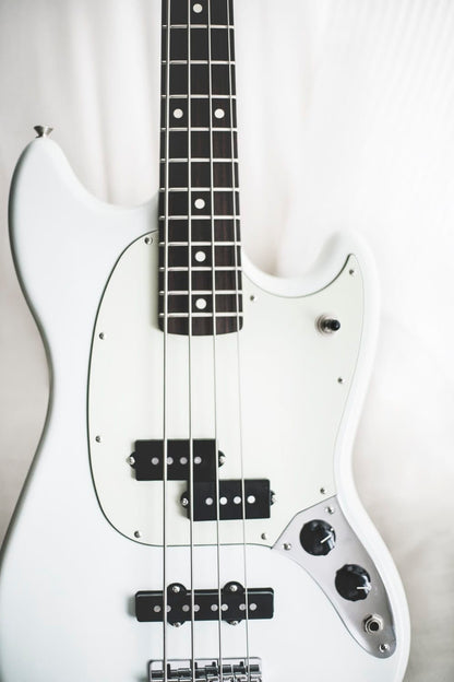 Cross Stitch | Bass - White And Black Electric Bass Guitar On White Surface - Cross Stitched