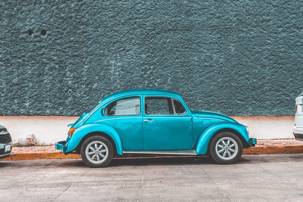 Cross Stitch | Beetle - Teal Volkswagen Beetle Car Parked Beside Sidewalk - Cross Stitched