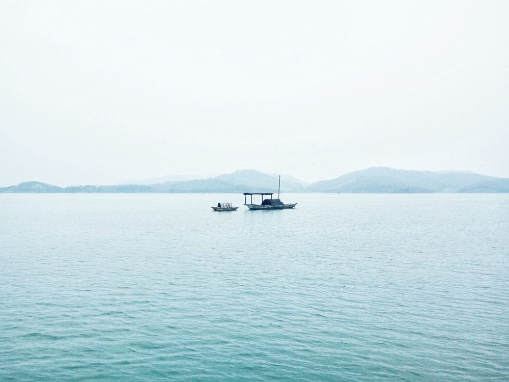 Cross Stitch | Changzhou - Two White Boats In Middle Of Sea During Daytime - Cross Stitched