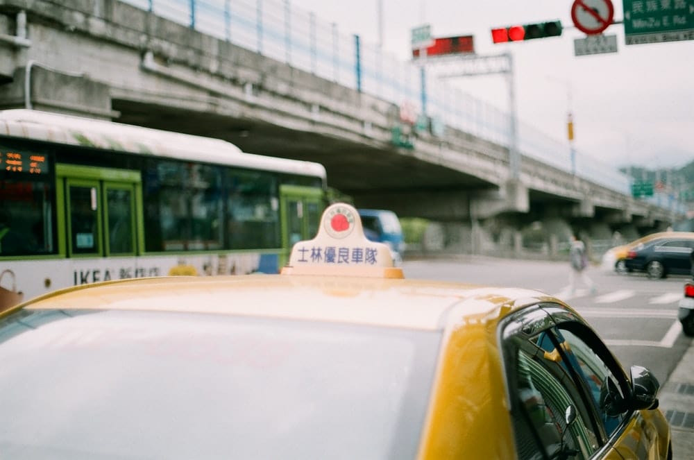 Cross Stitch | Chifeng - Yellow Taxi Cab On Road During Daytime - Cross Stitched