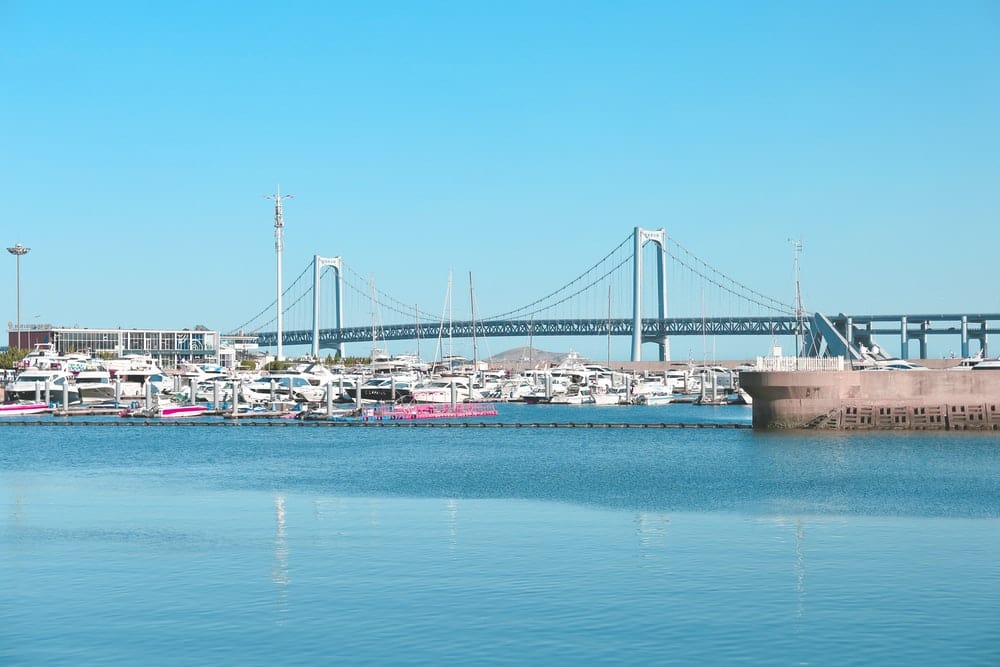 Cross Stitch | Dalian - White Boat On Sea Near Bridge During Daytime - Cross Stitched