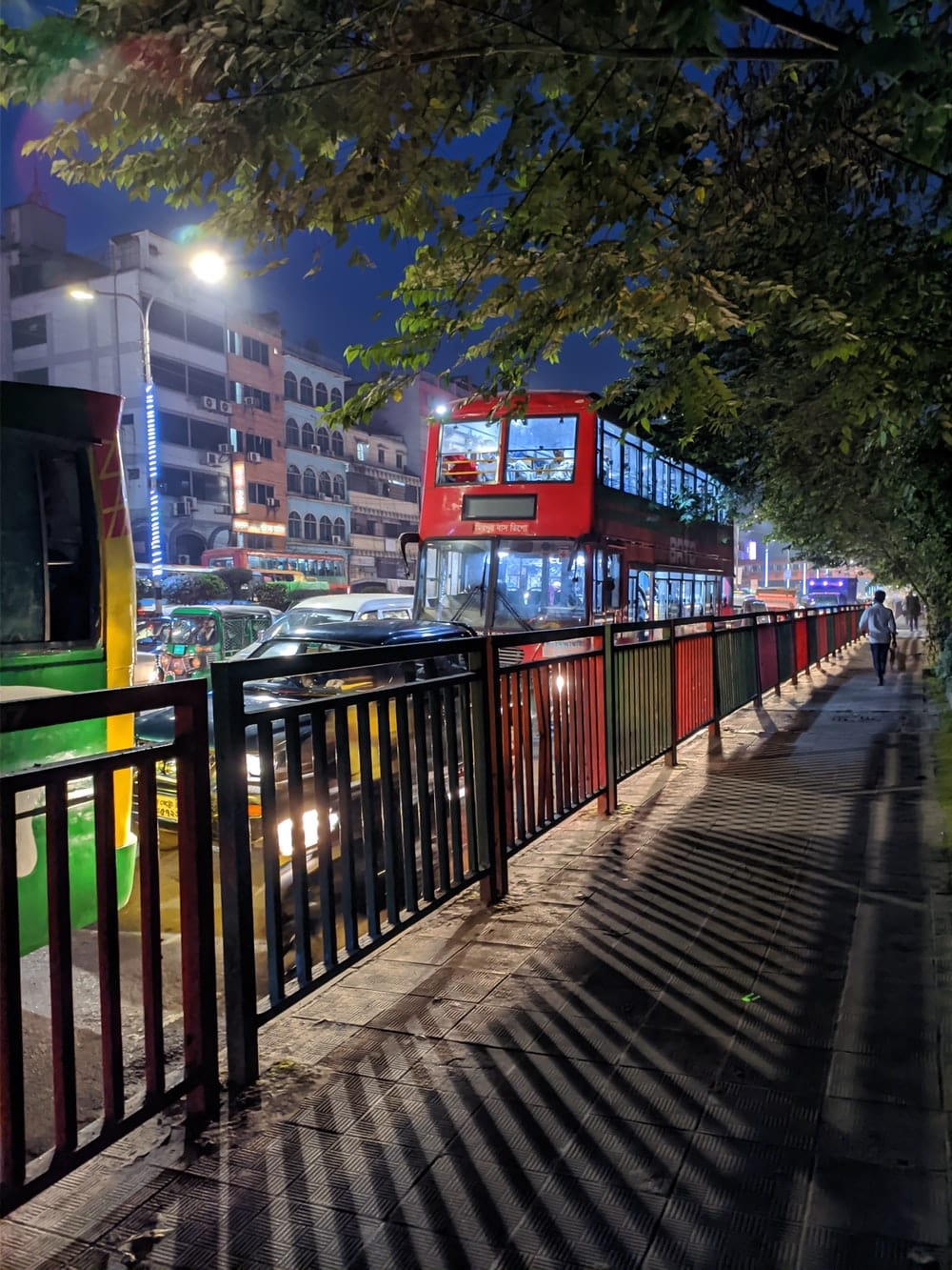 Cross Stitch | Dhaka - Black Metal Fence Near Green Trees During Night Time - Cross Stitched