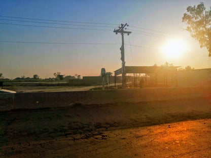 Cross Stitch | Faisalabad - Gray Electric Post On Brown Field During Daytime - Cross Stitched