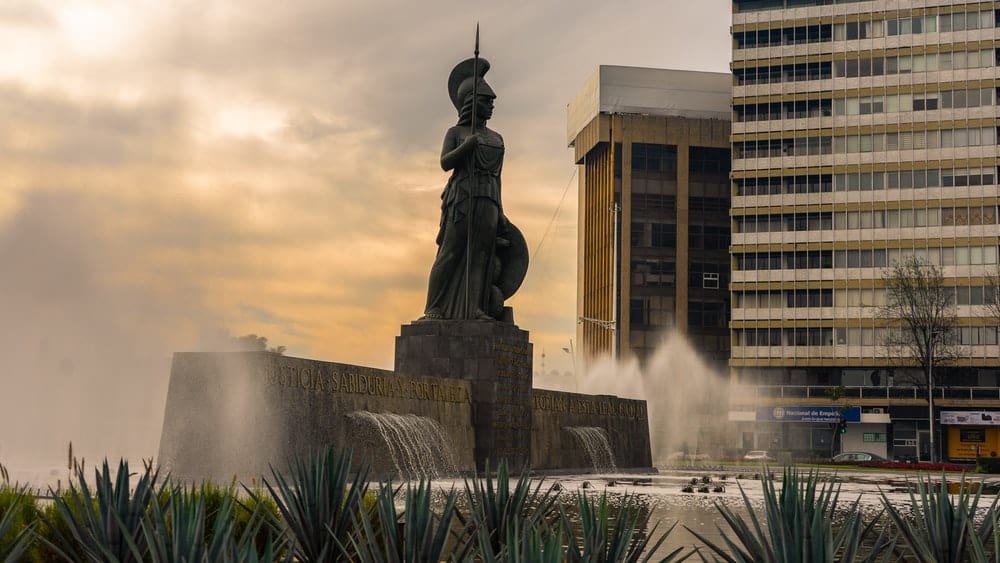 Cross Stitch | Guadalajara - Grey Knight Statue Near Building - Cross Stitched