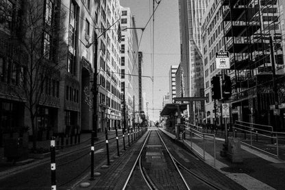 Cross Stitch | Houston - Grayscale Photo Of Train Rail Between Buildings - Cross Stitched