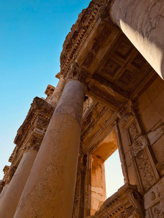 Cross Stitch | İzmir - Low Angle Photography Of Brown Concrete Building Under Blue Sky During Daytime - Cross Stitched