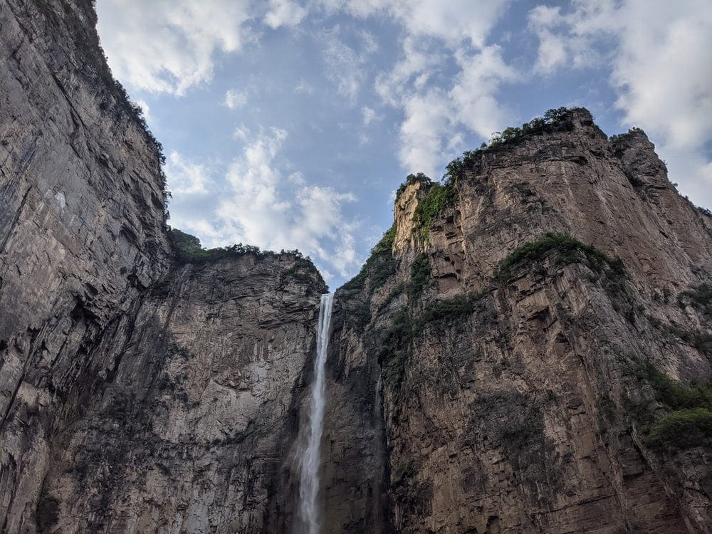 Cross Stitch | Jiaozuo - Waterfalls On Brown Rocky Mountain Under White Clouds During Daytime - Cross Stitched