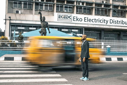 Cross Stitch | Lagos - Man Standing At Grey Concrete Road - Cross Stitched