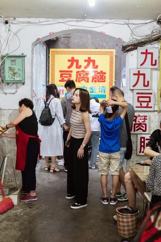 Cross Stitch | Leshan - People Standing Outside Kanji Store - Cross Stitched