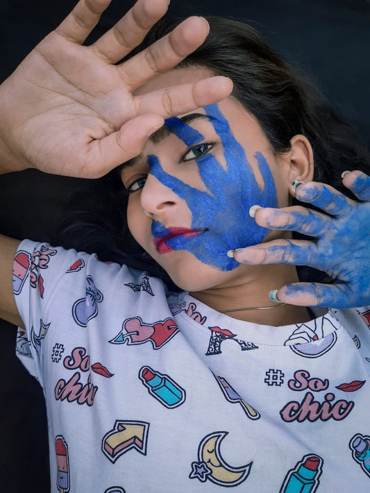 Cross Stitch | Lucknow - Girl In White And Red Shirt With Blue Paint On Face - Cross Stitched