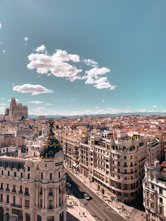 Cross Stitch | Madrid - Brown And Black Concrete Buildings At Daytime - Cross Stitched