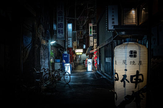 Cross Stitch | Ōsaka - Black Bicycle Parked Beside Building During Night Time - Cross Stitched