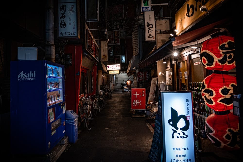 Cross Stitch | Ōsaka - Blue And White Pepsi Box On Street During Nighttime - Cross Stitched