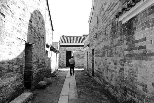 Cross Stitch | Qingyuan - Man In Black Jacket Walking On Street During Daytime - Cross Stitched