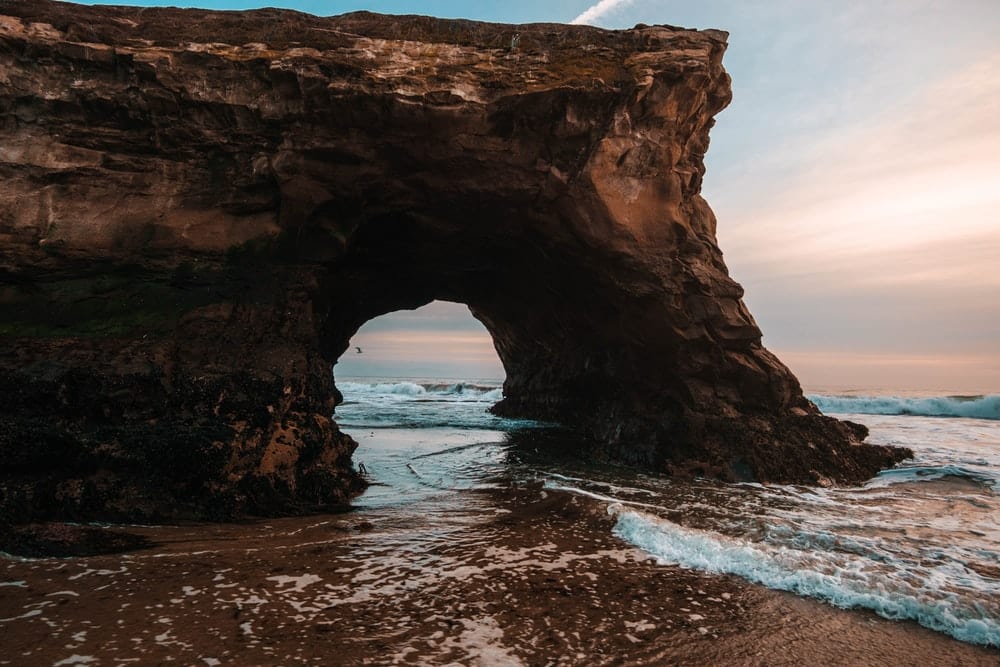 Cross Stitch | Santa Cruz - Photo Of Rock Formation Near Shoreline During Daytime - Cross Stitched