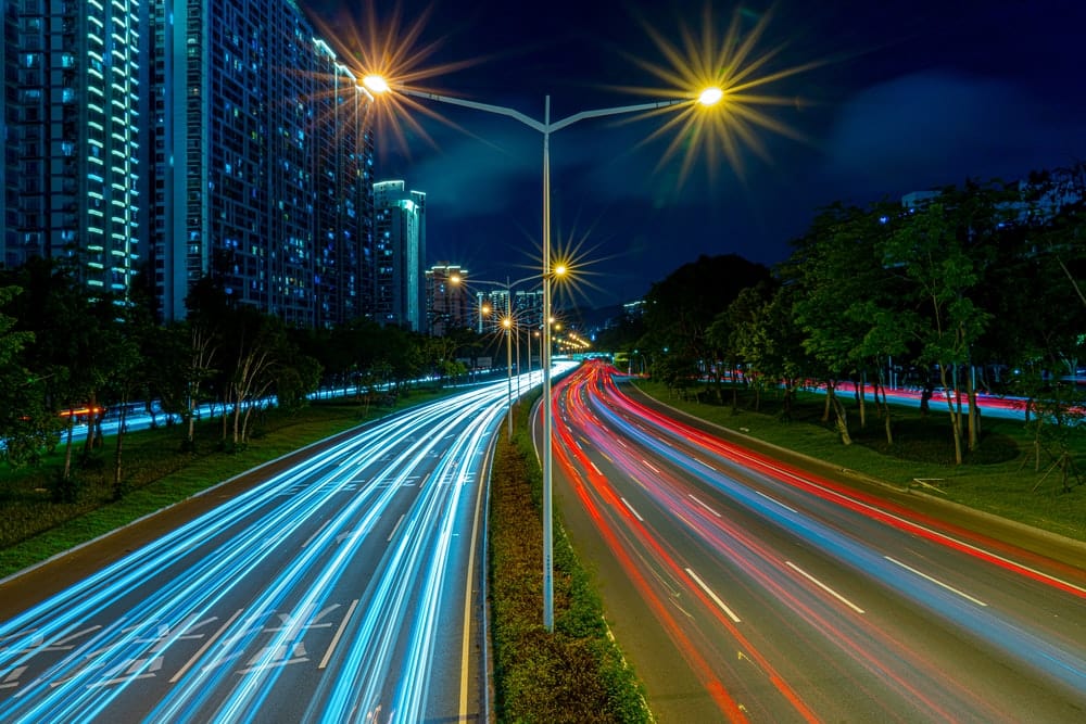 Cross Stitch | Shenzhen - Timelapse Photography Of Vehicle Tailights In Street With Lighted Post Beside Buildings At Daytime - Cross Stitched