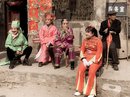 Cross Stitch | Taiyuan - 3 Women In Red Traditional Dress Sitting On Concrete Bench - Cross Stitched