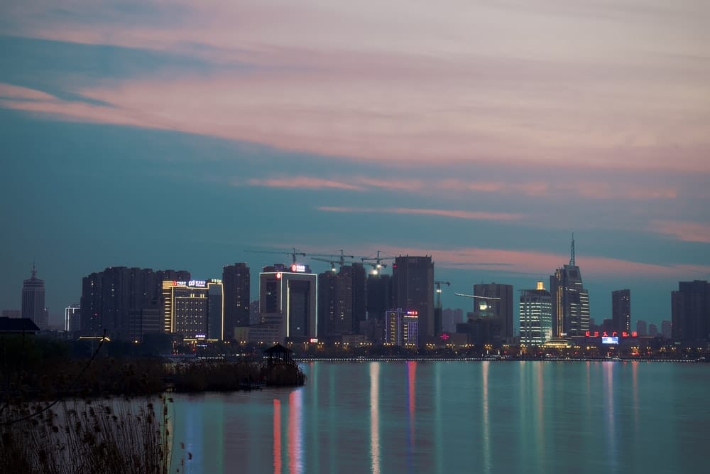 Cross Stitch | Zhenjiang - City Skyline Near Body Of Water During Night Time - Cross Stitched